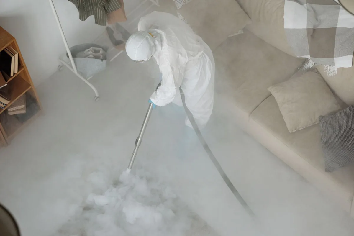 Biohazard cleanup technician in protective equipment, Vernon, AL